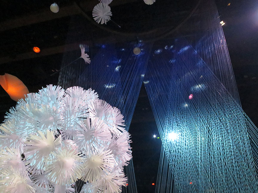 Stand inside the Dandelion Clock column and watch the seeds swirl up and around you.