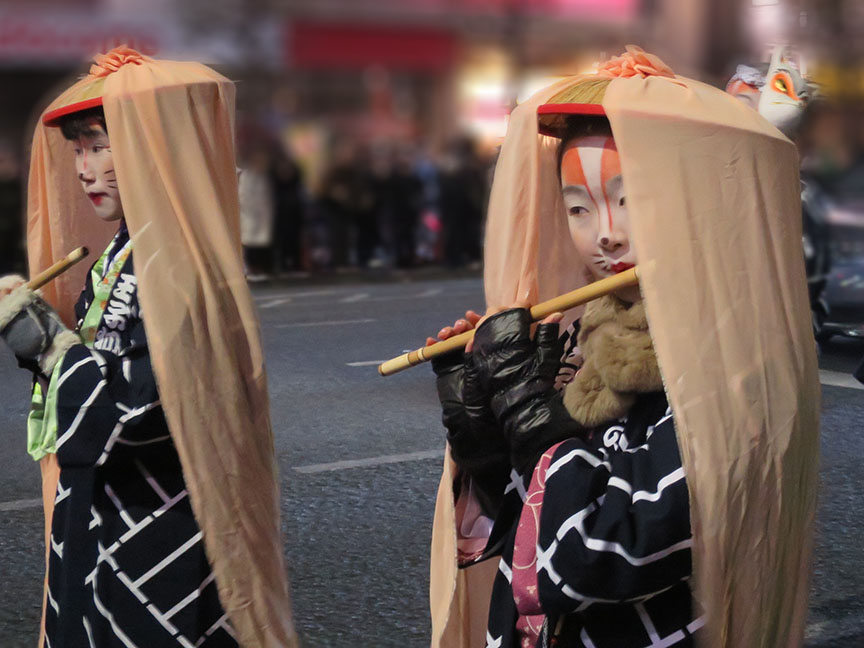 No shrine parade would be complete without flute-playing vixen.