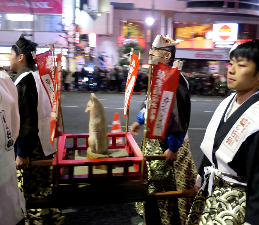 The venerable fox figure itself gets a ride through town...