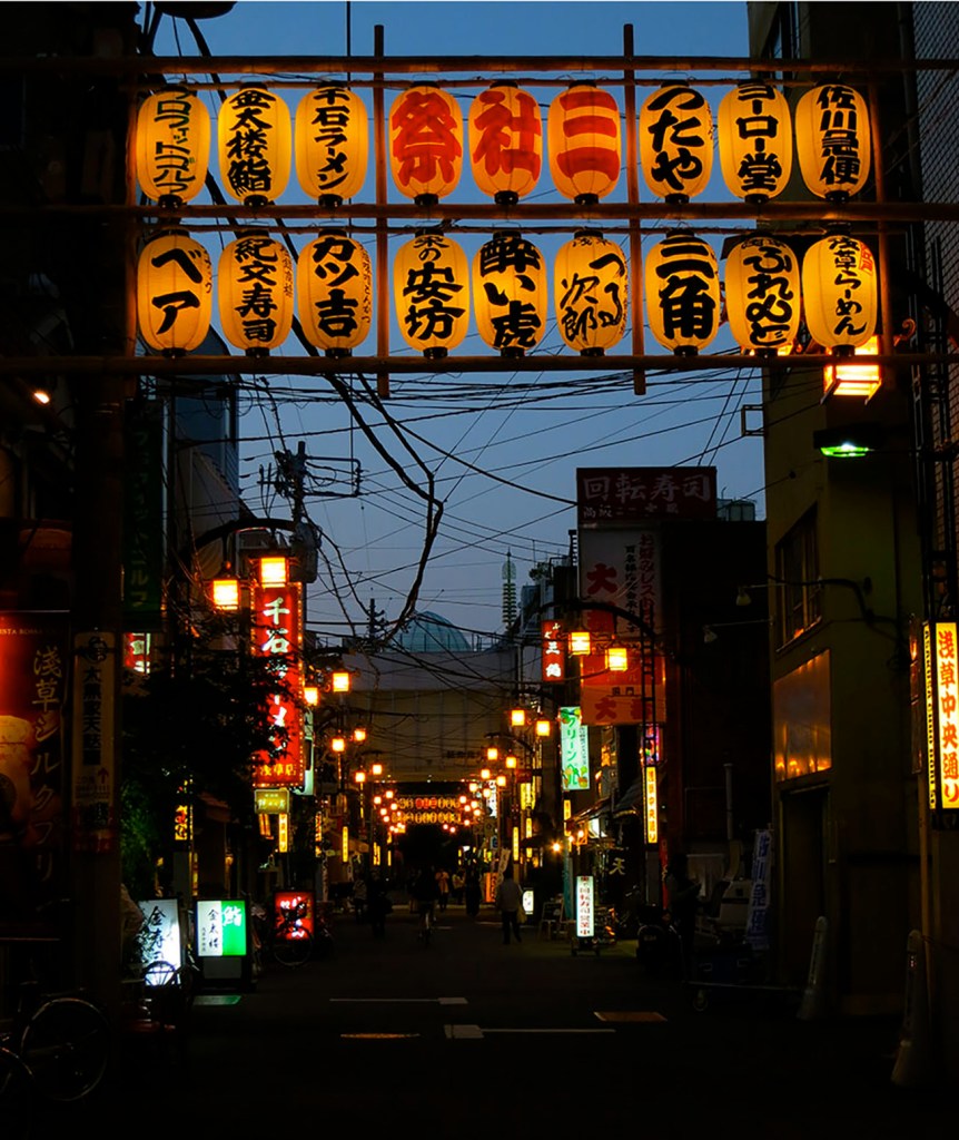 Old fashioned street in Asakusa lit up at night