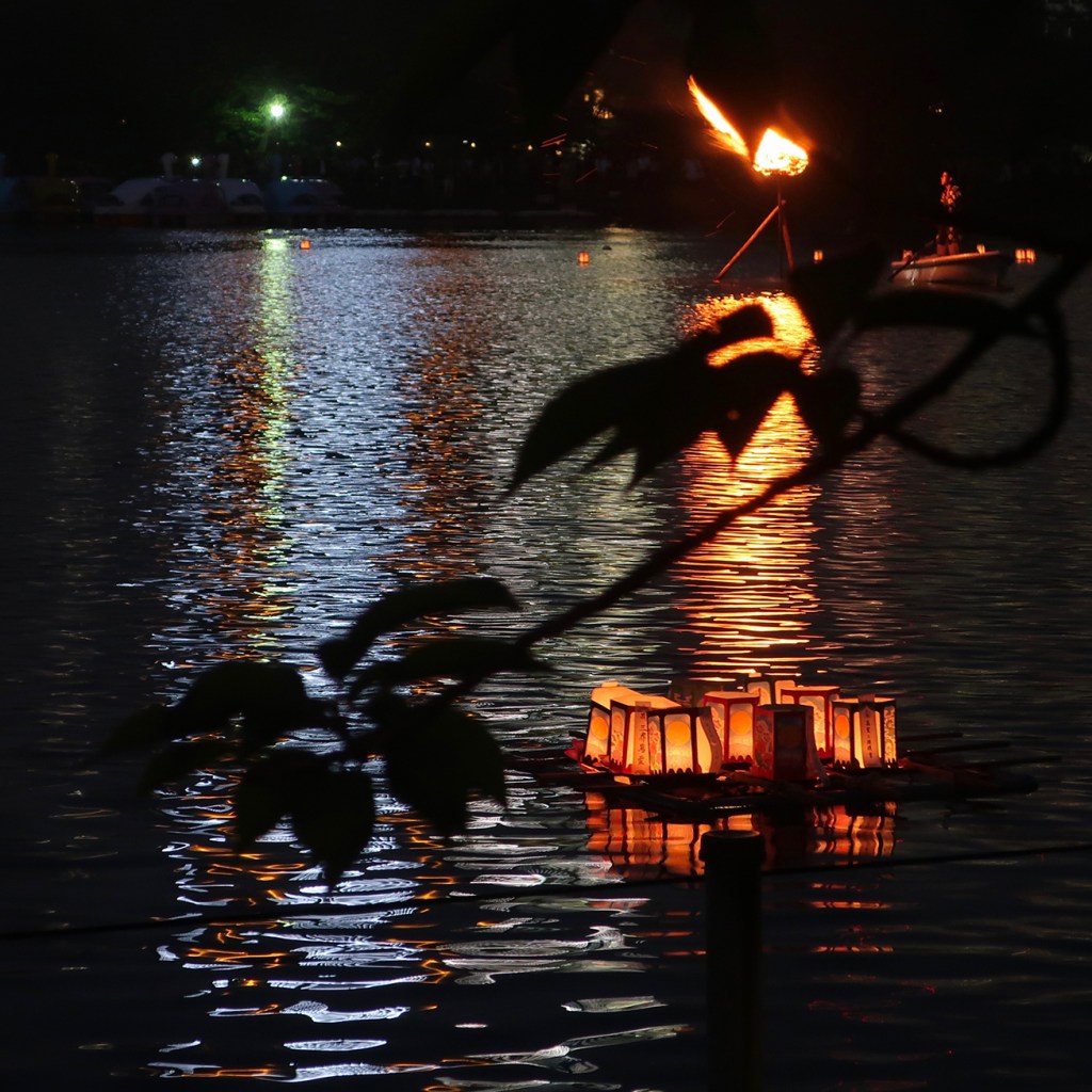 Lanterns and bonfire at toro nagashi event, Shinobazu Pond, Asakusa