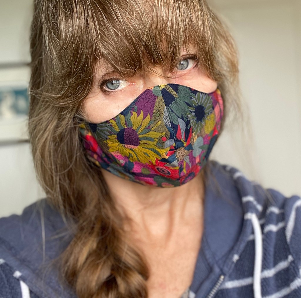 Jonelle Patrick wearing face mask made of floral Liberty print cotton