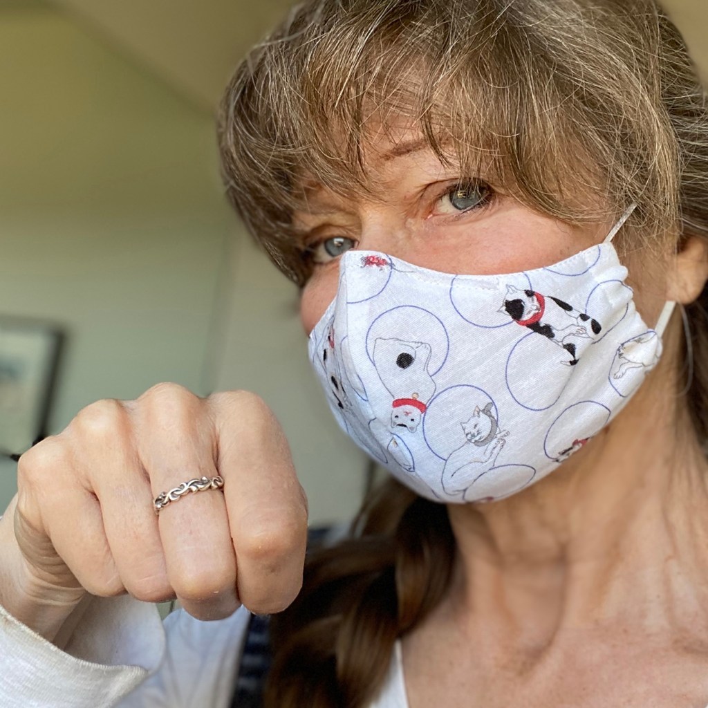 Jonelle Patrick wearing face mask with Kuniyoshi woodblock cats