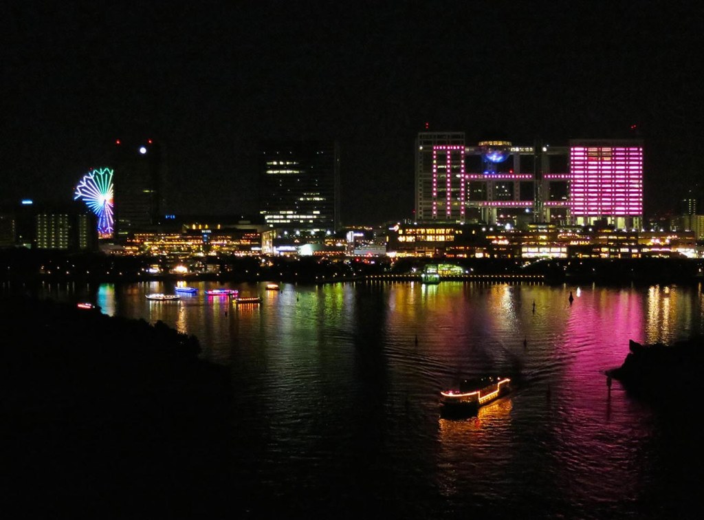 Odaiba skyline lit up at night with pleasure boats