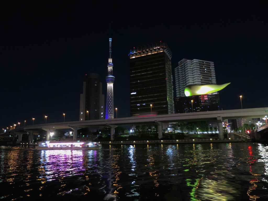 The Sumida River at night with skytree and a pleasure boat