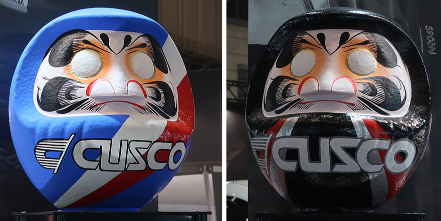 Daruma figures with CUZCO logo